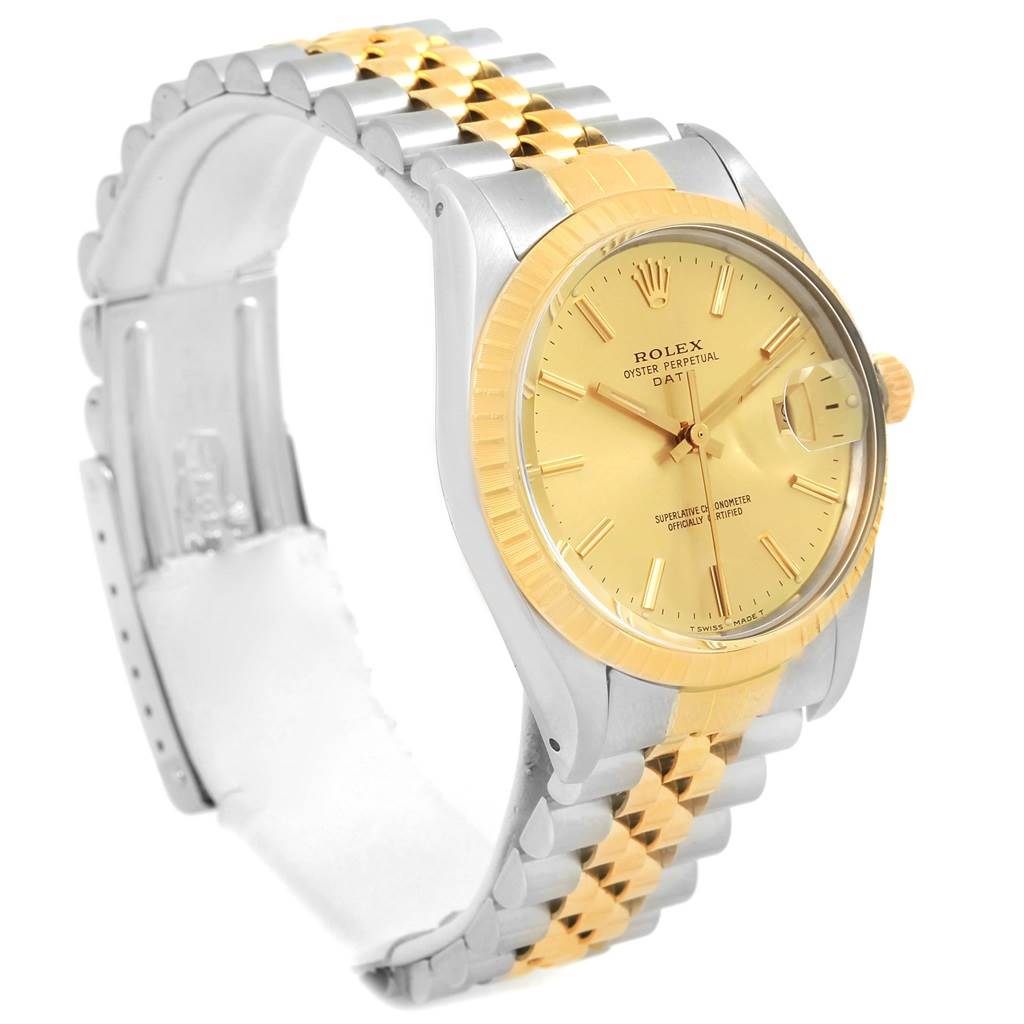 The Rolex Date 15053 Men's Steel and Gold (two tone) Champagne Dial 15053 Men's Steel and Gold (two tone) Champagne Dial model watch is shown at an angled view, highlighting its two-tone bracelet, dial, bezel, and crown.