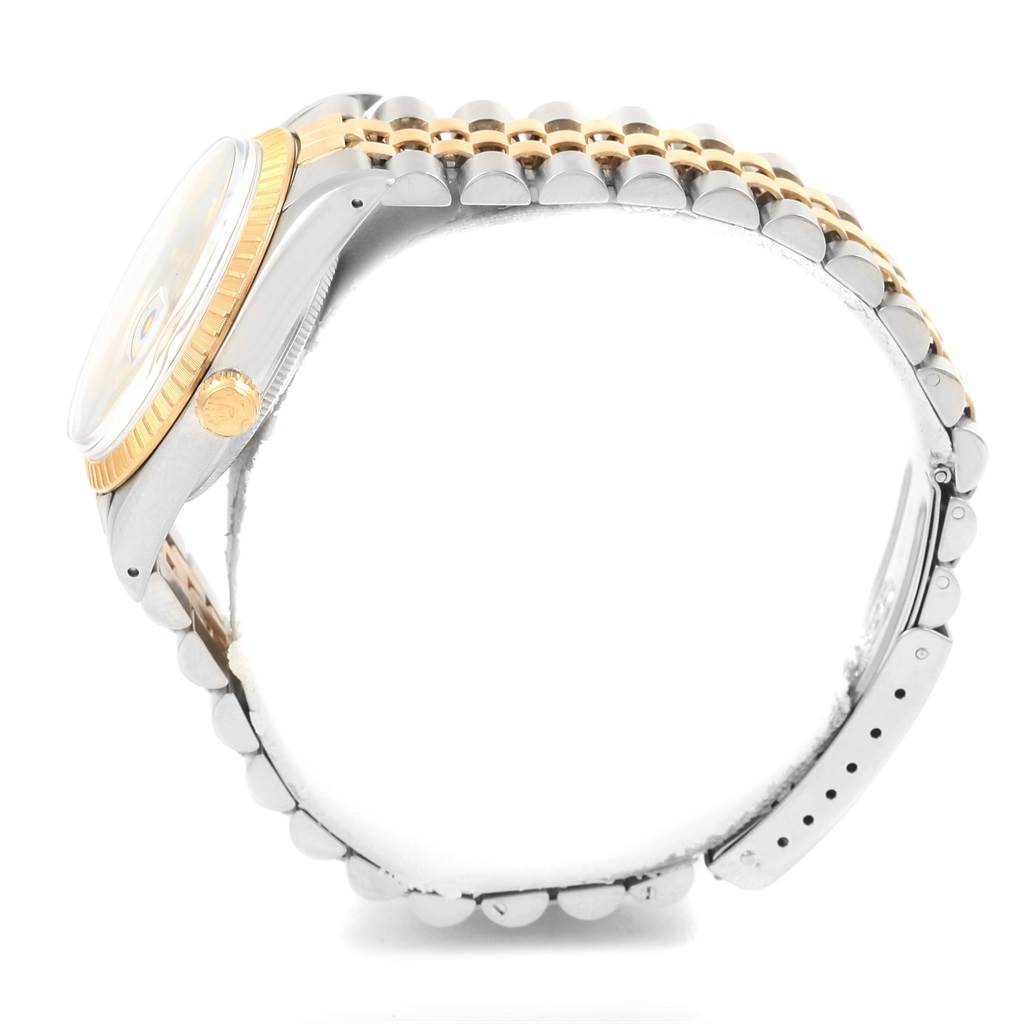 The image shows a side profile of a Rolex Date 15053 Men's Steel and Gold (two tone) Champagne Dial 15053 Men's Steel and Gold (two tone) Champagne Dial model, highlighting the crown, bezel, and part of the two-tone bracelet.