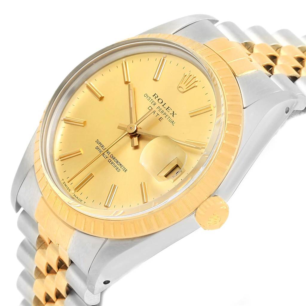 This image displays the Rolex Date 15053 Men's Steel and Gold (two tone) Champagne Dial 15053 Men's Steel and Gold (two tone) Champagne Dial model watch at a slight angle, showing its face, crown, bezel, and part of the bracelet.