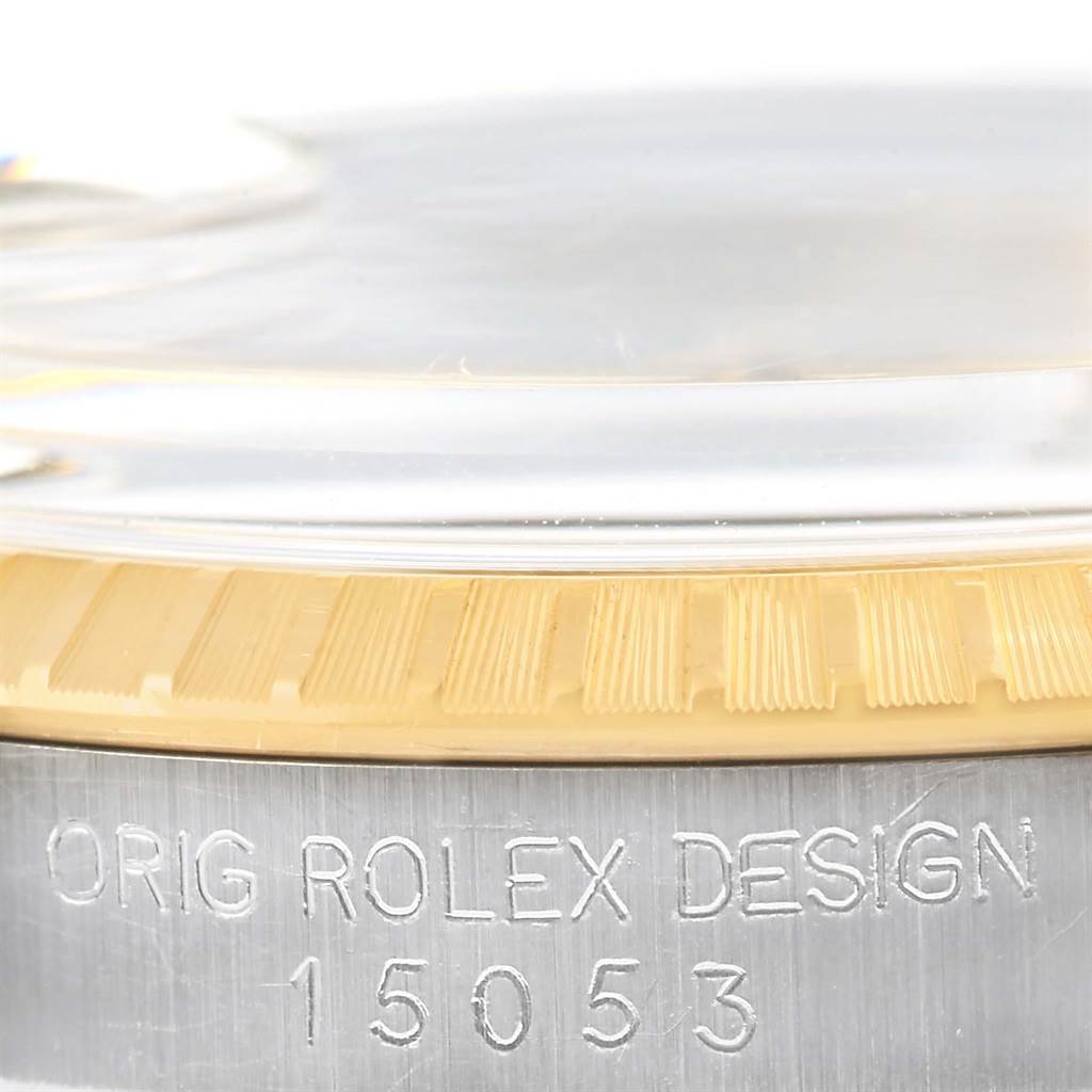 This close-up image shows the side view of the Rolex Date 15053 Men's Steel and Gold (two tone) Champagne Dial 15053 Men's Steel and Gold (two tone) Champagne Dial model, highlighting the engraved design and model number 15053.