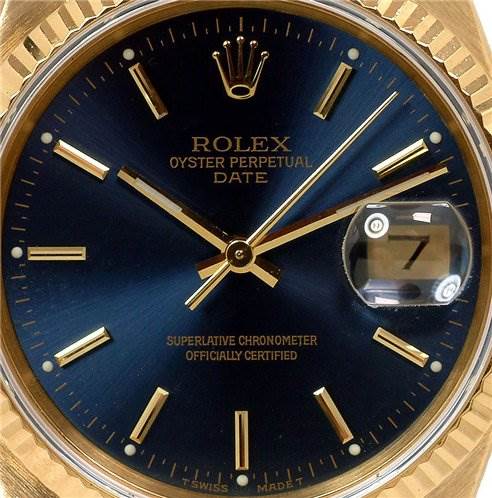 This image shows a close-up of the dial, hands, and date window of a Rolex Oyster Perpetual Date watch.