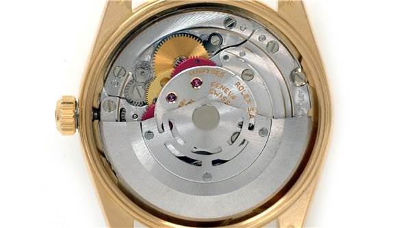 This image shows the internal mechanism of a Rolex Date 15238 Men's Yellow Gold Blue Dial 15238 Men's Yellow Gold Blue Dial model watch from a back view, revealing its intricate gears and components.