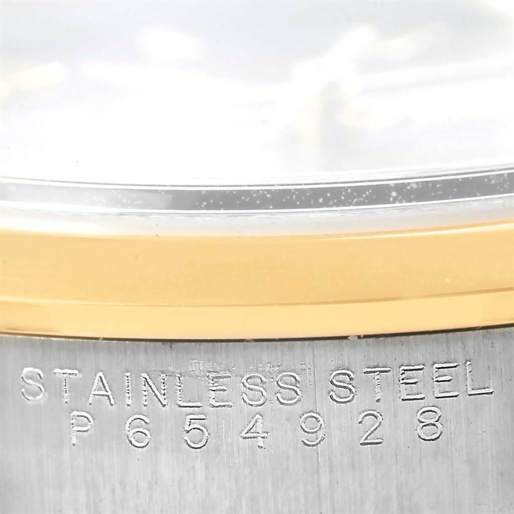 The image shows a close-up of the stainless steel case back and gold bezel of a Rolex Date 15203 Men's Steel and Gold (two tone) Grey Dial 15203 Men's Steel and Gold (two tone) Grey Dial model watch.