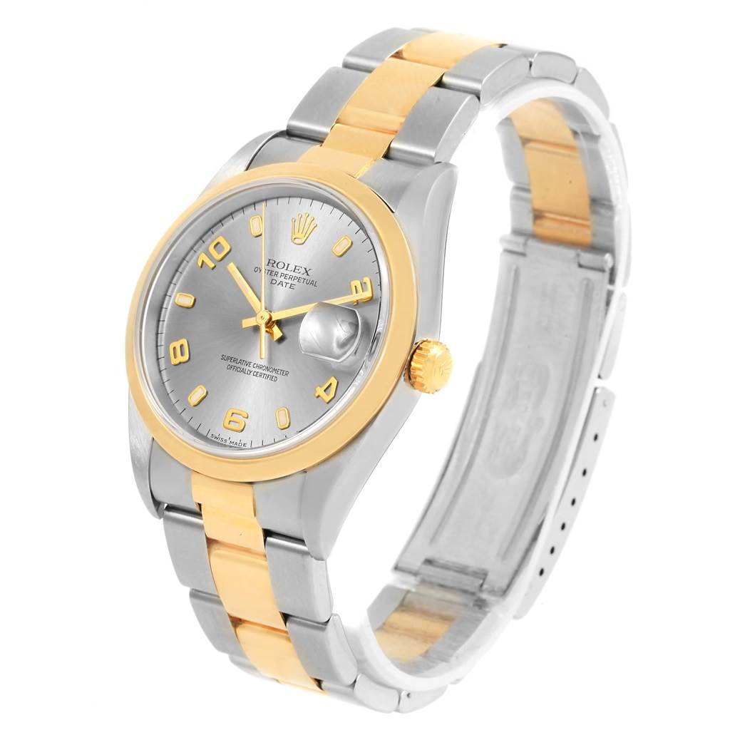 The Rolex Date 15203 Men's Steel and Gold (two tone) Grey Dial 15203 Men's Steel and Gold (two tone) Grey Dial model watch is shown at a slight angle, displaying the face, bezel, crown, and part of the bracelet.