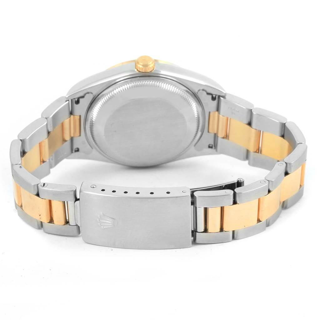 This is a rear view of a Rolex Date 15203 Men's Steel and Gold (two tone) Grey Dial 15203 Men's Steel and Gold (two tone) Grey Dial model, showing the watch case, bracelet, and clasp.