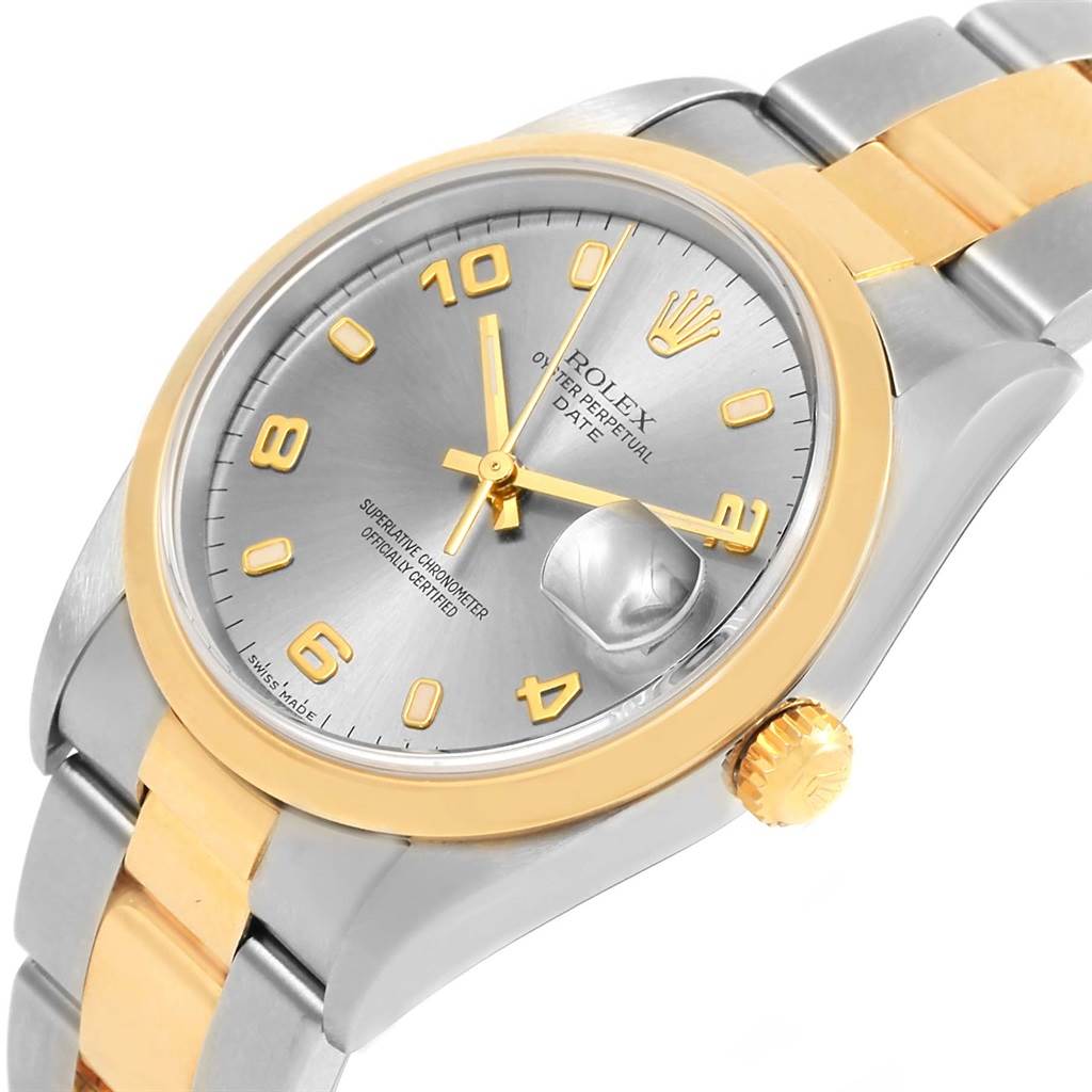 The Rolex Date 15203 Men's Steel and Gold (two tone) Grey Dial 15203 Men's Steel and Gold (two tone) Grey Dial model watch is shown at a slight angle, displaying the face, bezel, crown, and part of the bracelet.