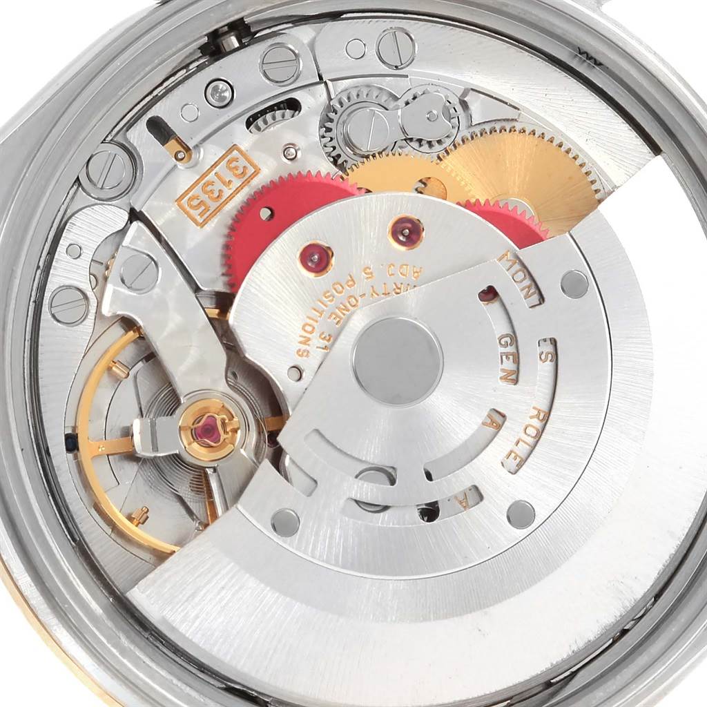 This is a close-up of the internal movement of a Rolex Date 15203 Men's Steel and Gold (two tone) Grey Dial 15203 Men's Steel and Gold (two tone) Grey Dial model watch, showcasing its gears and components.
