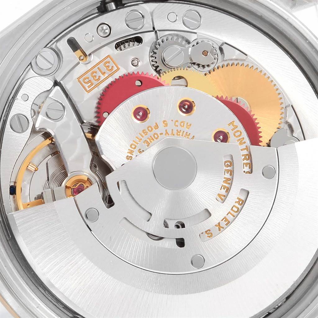The image shows the intricate internal mechanism or movement of the Rolex Date 15223 Men's Steel and Gold (two tone) Champagne Dial 15223 Men's Steel and Gold (two tone) Champagne Dial model watch.