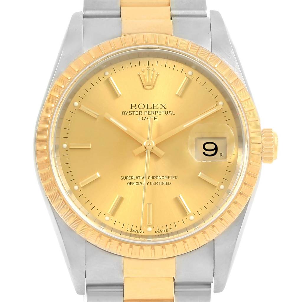 This image shows a Rolex Oyster Perpetual Date watch from a front angle, highlighting the gold dial and silver-gold bracelet.