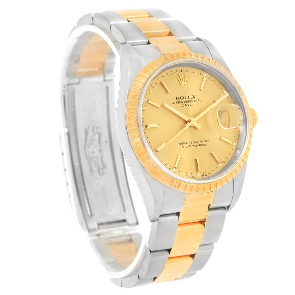 The image shows a side-angle view of a Rolex Date 15223 Men's Steel and Gold (two tone) Champagne Dial 15223 Men's Steel and Gold (two tone) Champagne Dial model watch displaying its face, bezel, and two-tone bracelet.