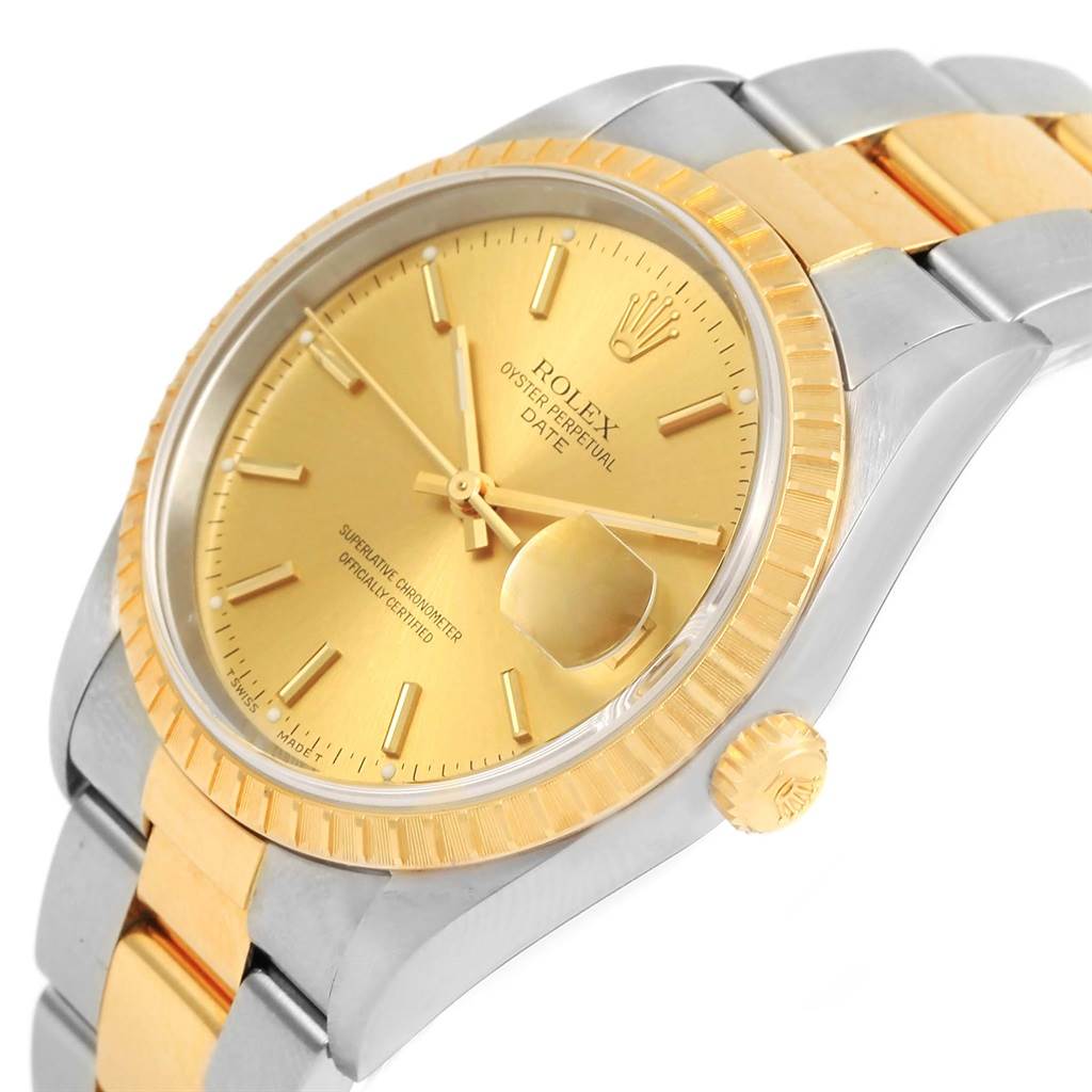 The image shows a close-up view of a Rolex Oyster Perpetual Date, highlighting the gold dial, fluted bezel, and two-tone bracelet.