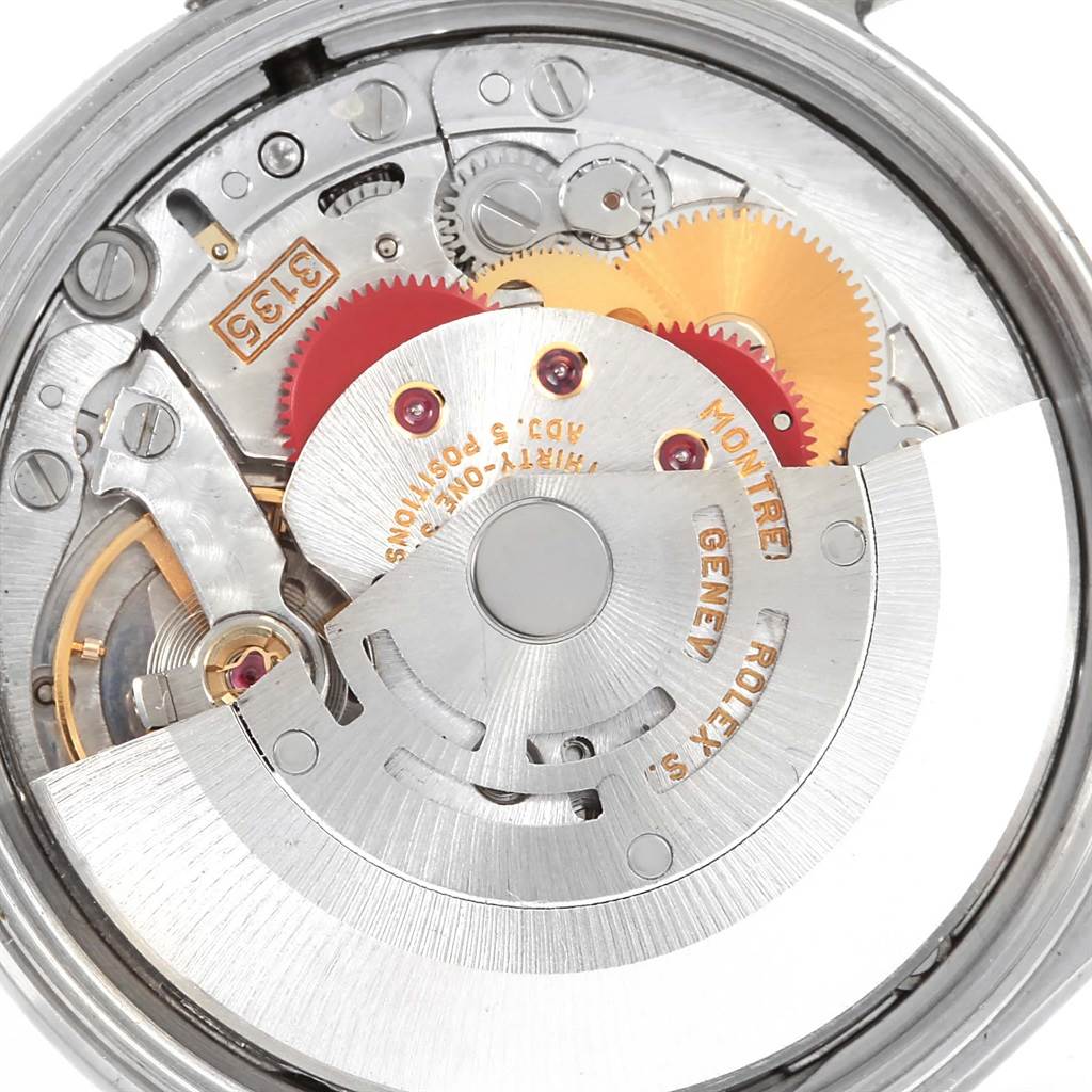 The image shows a close-up view of the movement and internal mechanisms of a Rolex Date 15200 Men's Stainless Steel Blue Dial 15200 Men's Stainless Steel Blue Dial model.