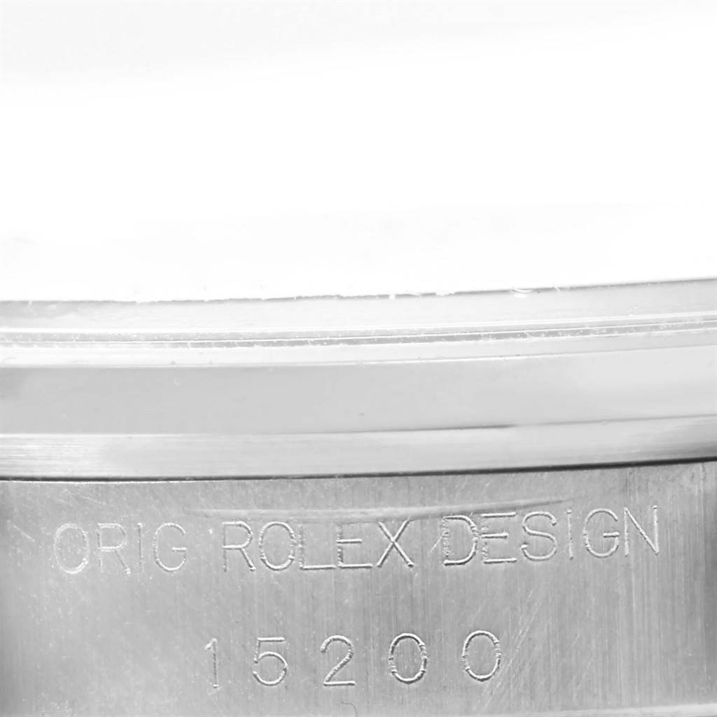 The image shows an engraved side view of a Rolex Date 15200 Men's Stainless Steel Blue Dial 15200 Men's Stainless Steel Blue Dial model watch, displaying its model number and "ORIG ROLEX DESIGN" inscription.