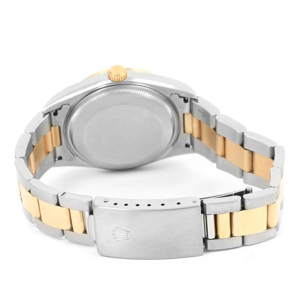 The image shows the back case, crown, and bracelet of a Rolex Date 15203 Men's Steel and Gold (two tone) Black Dial 15203 Men's Steel and Gold (two tone) Black Dial model watch from a rear angle.