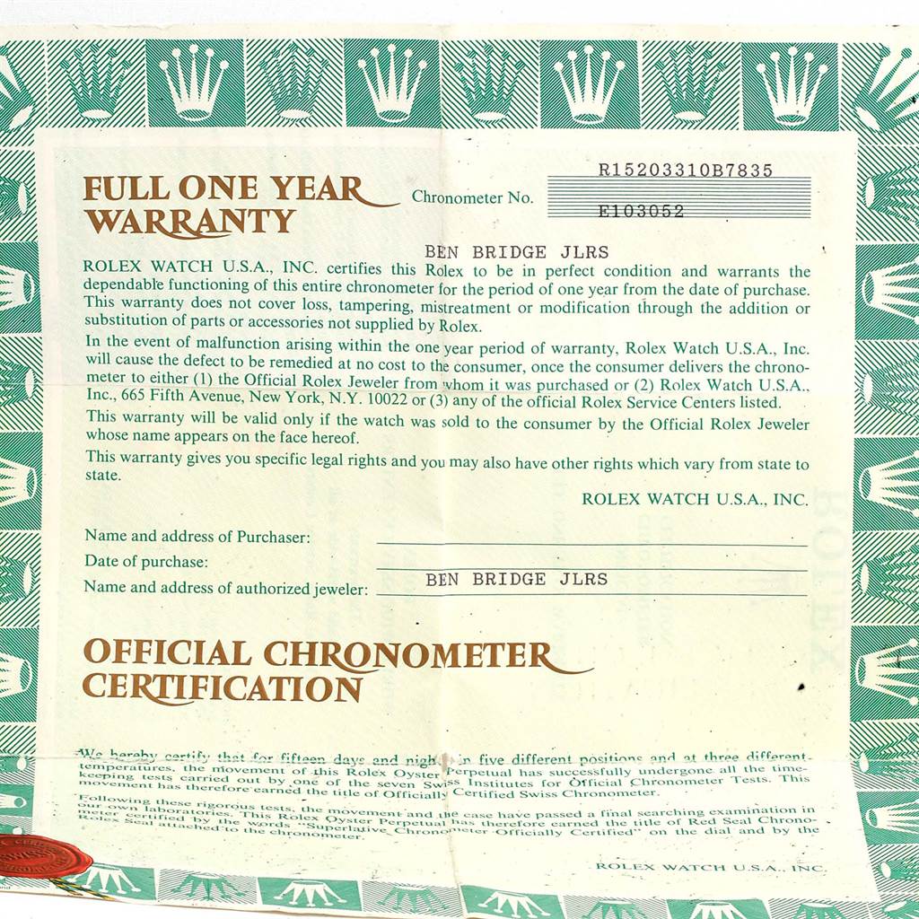 The image shows an official one-year warranty card and chronometer certification for a Rolex Date 15203 Men's Steel and Gold (two tone) Silver Dial 15203 Men's Steel and Gold (two tone) Silver Dial model watch.