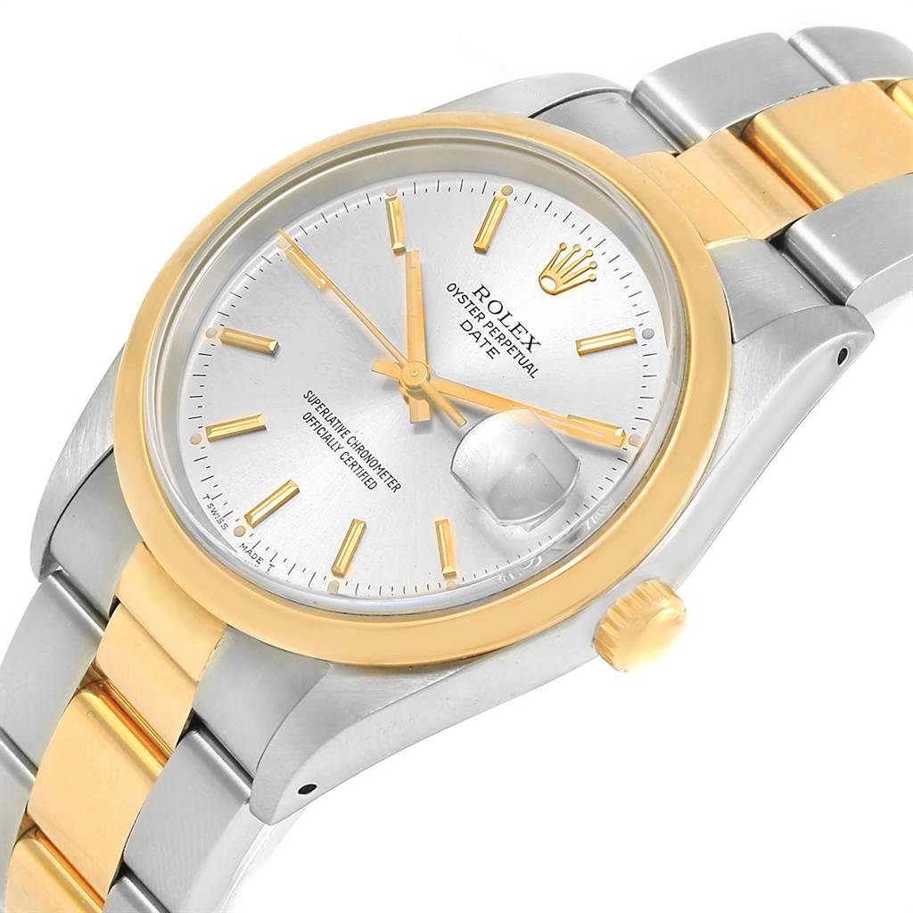 The image shows a close-up of a Rolex Date 15203 Men's Steel and Gold (two tone) Silver Dial 15203 Men's Steel and Gold (two tone) Silver Dial watch, highlighting the dial, bezel, and part of the bracelet at an angle.