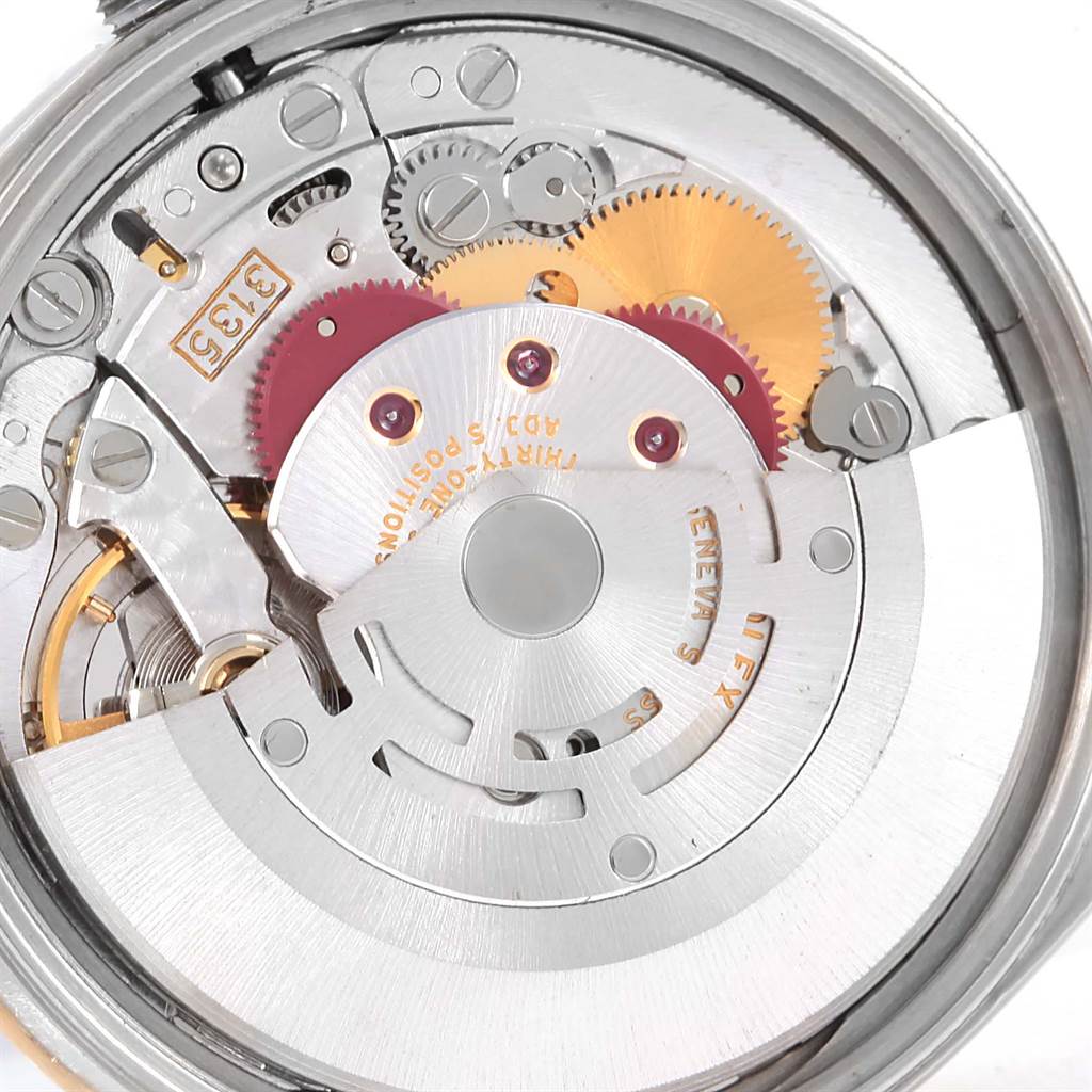 The image shows the internal mechanical movement of a Rolex Date 15203 Men's Steel and Gold (two tone) Silver Dial 15203 Men's Steel and Gold (two tone) Silver Dial model watch, highlighting gears and various intricate components.