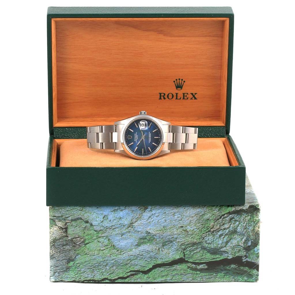 The Rolex Date 15200 Men's Stainless Steel Blue Dial 15200 Men's Stainless Steel Blue Dial model watch is displayed front-on with its bracelet and case visible in an open Rolex box.