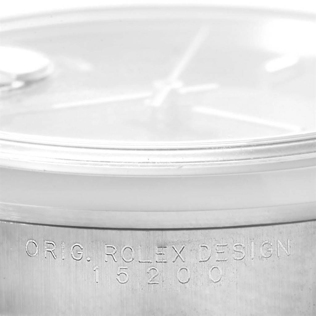 Close-up of a Rolex Date 15200 Men's Stainless Steel Blue Dial 15200 Men's Stainless Steel Blue Dial model showing the side case with "ORIG. ROLEX DESIGN 15200" engraved.