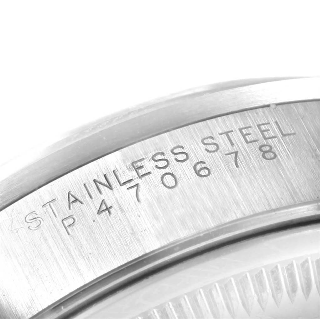 The image shows a close-up of the stainless steel case back with engraved text of a Rolex Date 15200 Men's Stainless Steel White Dial 15200 Men's Stainless Steel White Dial model watch.