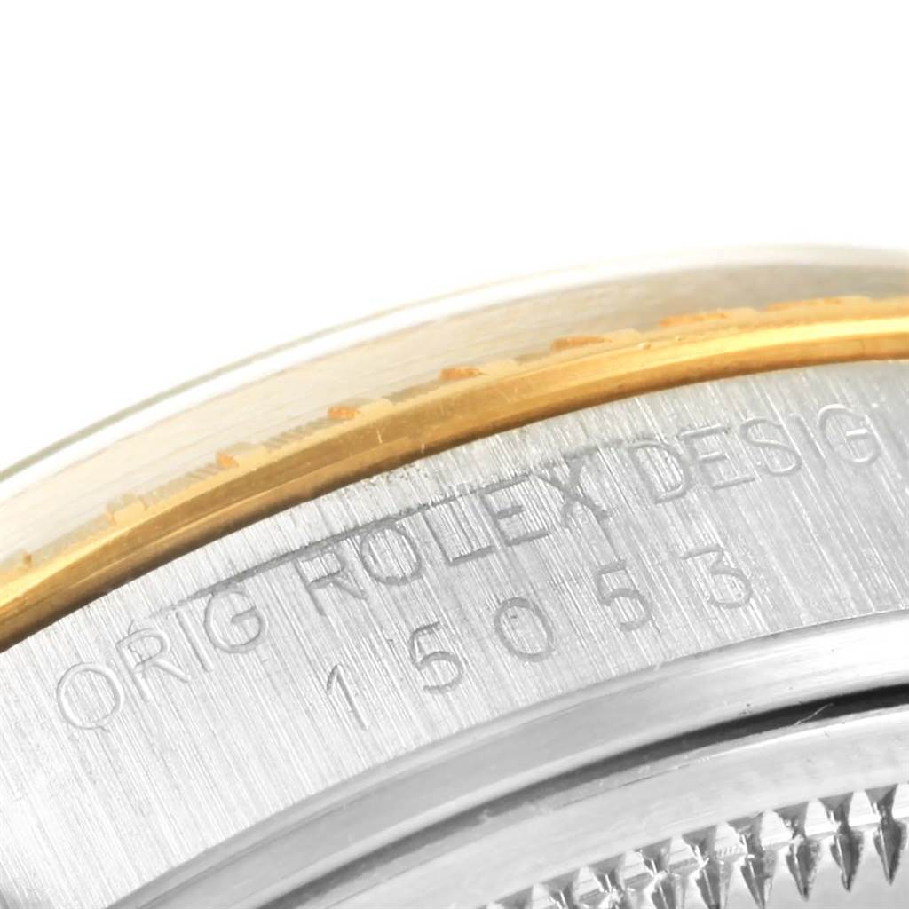 This image shows a close-up of the bezel and case of a Rolex Date 15053 Men's Steel and Gold (two tone) White Dial 15053 Men's Steel and Gold (two tone) White Dial model watch, including engraved text.