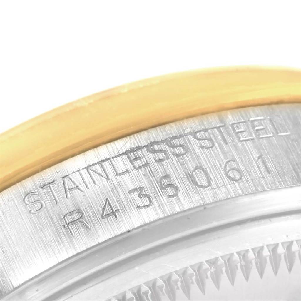 The image shows a close-up of the stainless steel case back and the serial number engraving on a Rolex Date 15053 Men's Steel and Gold (two tone) White Dial 15053 Men's Steel and Gold (two tone) White Dial model watch.