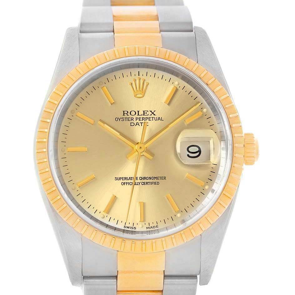 This image shows a front view of a Rolex Oyster Perpetual Date watch, highlighting its gold and silver color scheme and date window.