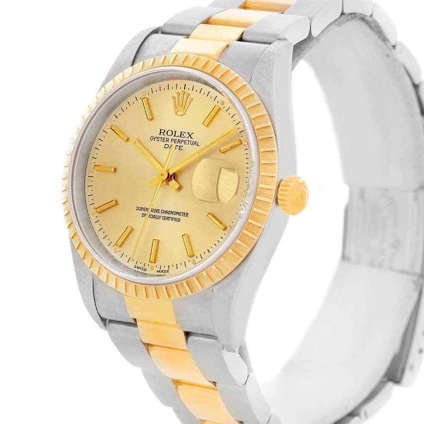 The image shows a Rolex Date 15223 Men's Steel and Gold (two tone) Champagne Dial 15223 Men's Steel and Gold (two tone) Champagne Dial model watch at a three-quarter angle, highlighting its gold and silver bracelet, dial, and fluted bezel.
