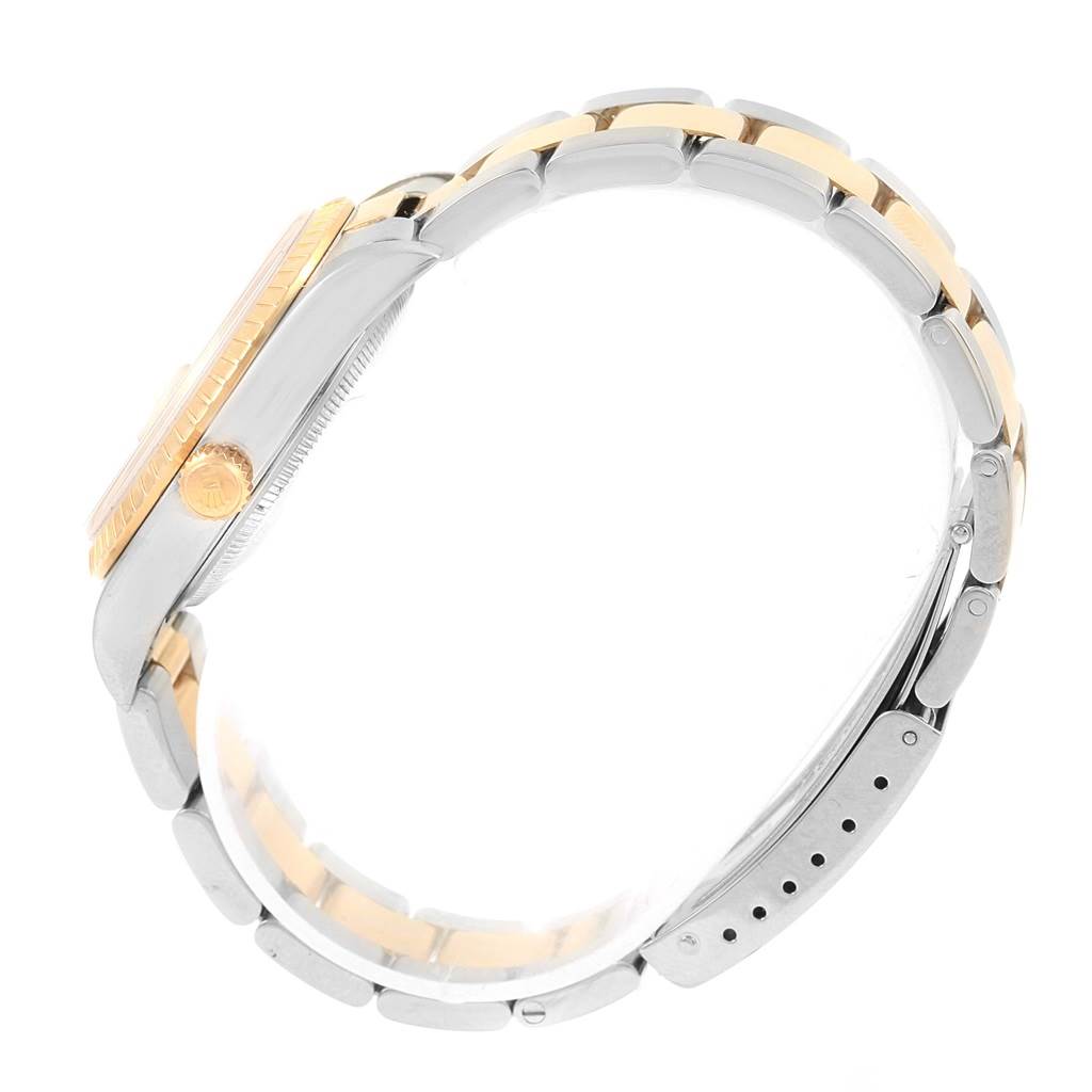 The image shows a side view of the Rolex Date 15223 Men's Steel and Gold (two tone) Champagne Dial 15223 Men's Steel and Gold (two tone) Champagne Dial model watch, highlighting the crown, bezel, case, and bracelet.