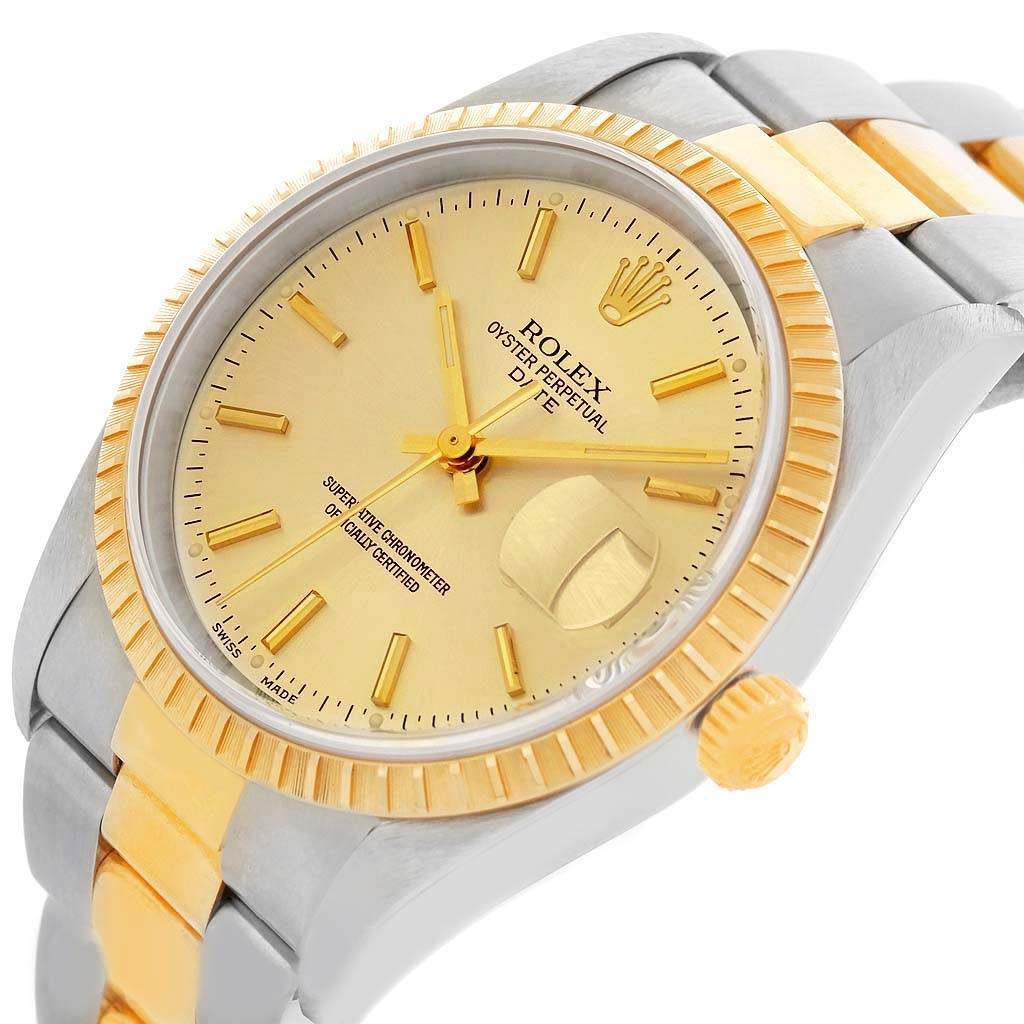 The Rolex Date 15223 Men's Steel and Gold (two tone) Champagne Dial 15223 Men's Steel and Gold (two tone) Champagne Dial model watch is shown at a slight angle, displaying the face, bezel, and two-tone bracelet.