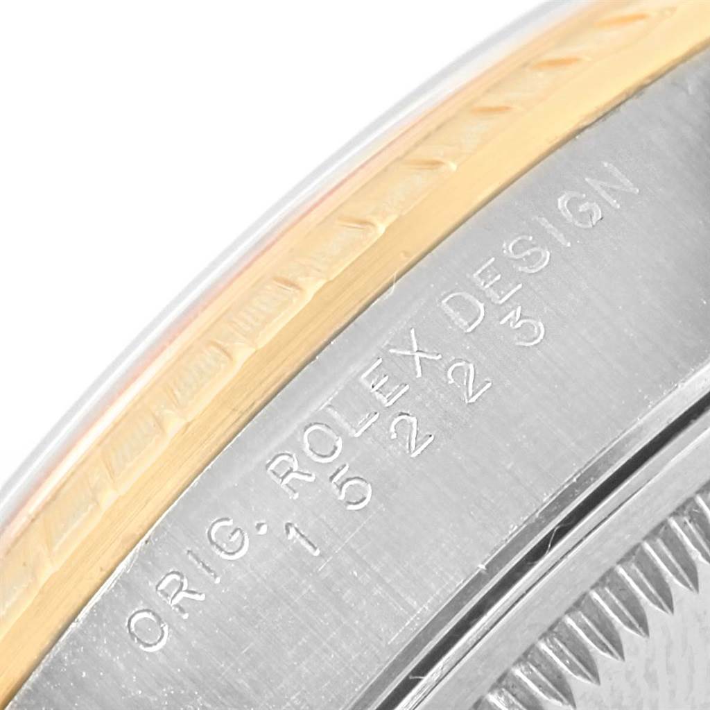 The image shows a close-up of the side of a Rolex Date 15223 Men's Steel and Gold (two tone) Champagne Dial 15223 Men's Steel and Gold (two tone) Champagne Dial model watch, highlighting the engraved serial number and design details.