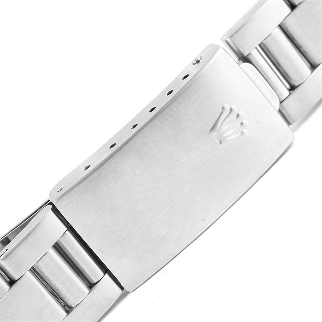 This image shows a close-up of the clasp of a Rolex Date 15200 Men's Stainless Steel Blue Dial 15200 Men's Stainless Steel Blue Dial watch, featuring its stainless steel bracelet.