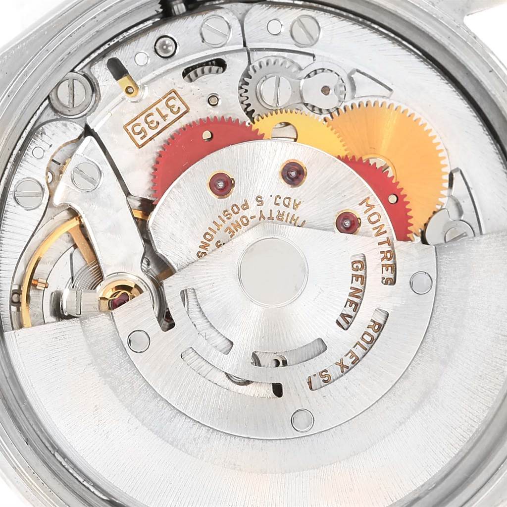 This is an interior view of a Rolex Date 15200 Men's Stainless Steel Blue Dial 15200 Men's Stainless Steel Blue Dial model watch, showcasing its intricate internal mechanical components and gears.