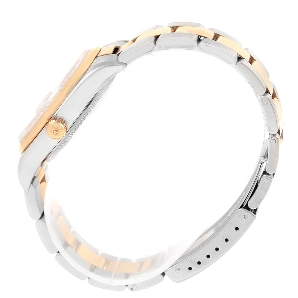 This image shows a side angle of the Rolex Date 15203 Men's Steel and Gold (two tone) Blue Dial 15203 Men's Steel and Gold (two tone) Blue Dial model watch, highlighting its bracelet and the crown.