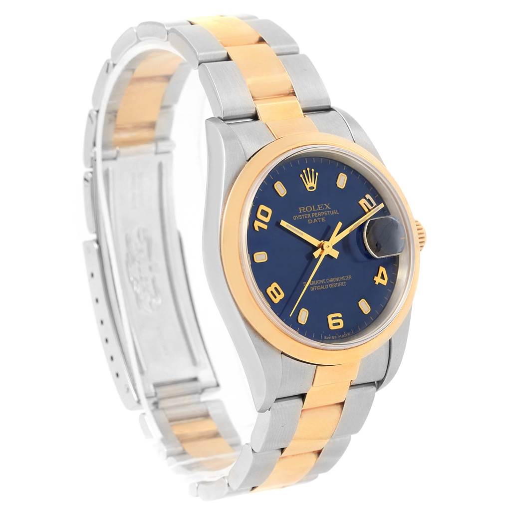 The image shows a Rolex Date 15203 Men's Steel and Gold (two tone) Blue Dial 15203 Men's Steel and Gold (two tone) Blue Dial watch at an angled view, highlighting its bezel, dial, and two-tone bracelet.