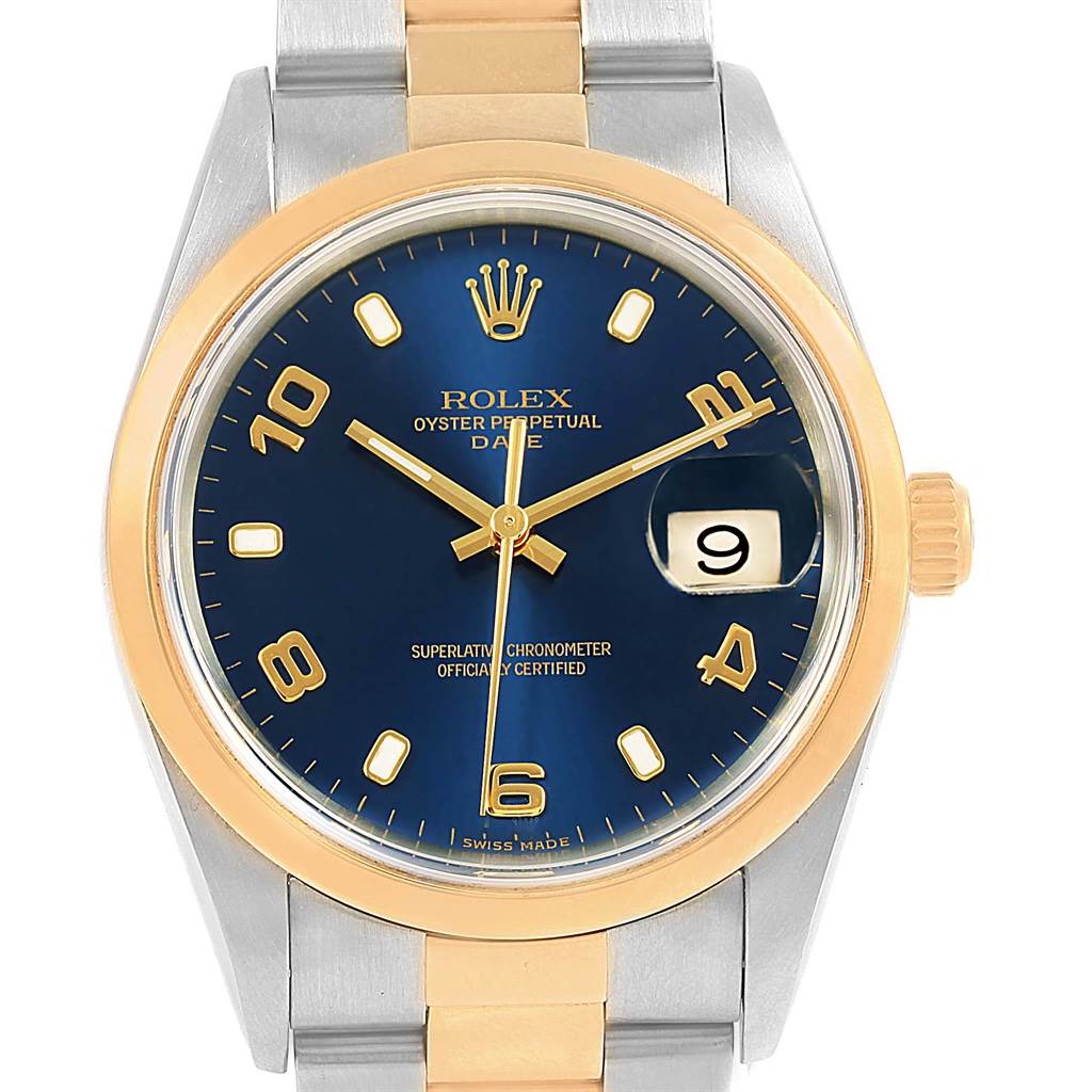 The image shows a Rolex Date 15203 Men's Steel and Gold (two tone) Blue Dial 15203 Men's Steel and Gold (two tone) Blue Dial model watch, displaying its blue dial, gold hour markers, hands, date window, and two-tone bracelet.