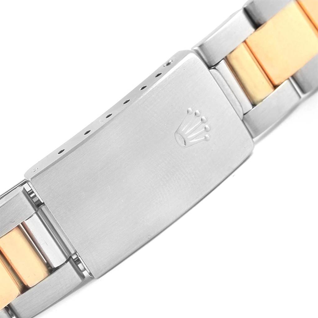 This image shows a close-up view of the clasp and part of the bracelet of a Rolex Date 15203 Men's Steel and Gold (two tone) Blue Dial 15203 Men's Steel and Gold (two tone) Blue Dial model watch.