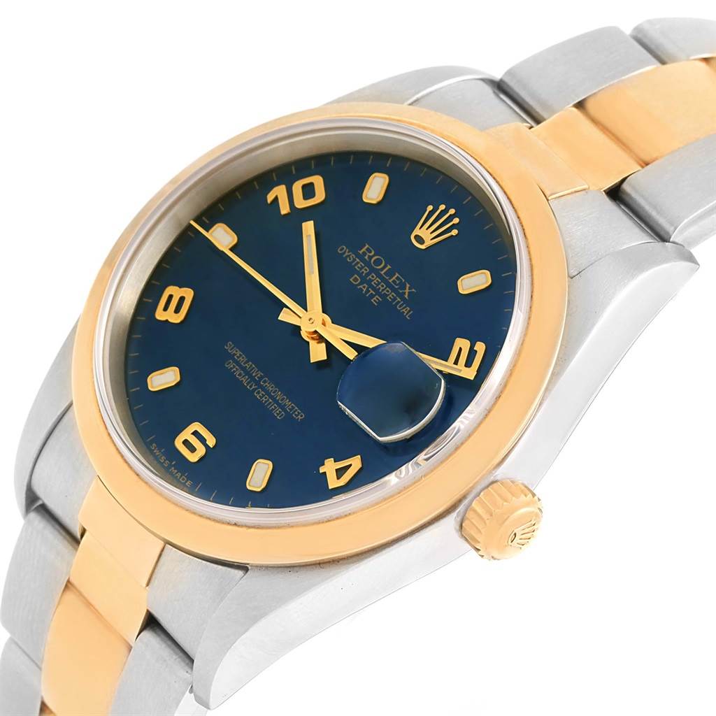 The image shows a close-up angle of the Rolex Date 15203 Men's Steel and Gold (two tone) Blue Dial 15203 Men's Steel and Gold (two tone) Blue Dial watch, highlighting its blue dial, gold markers, and two-tone metal bracelet.