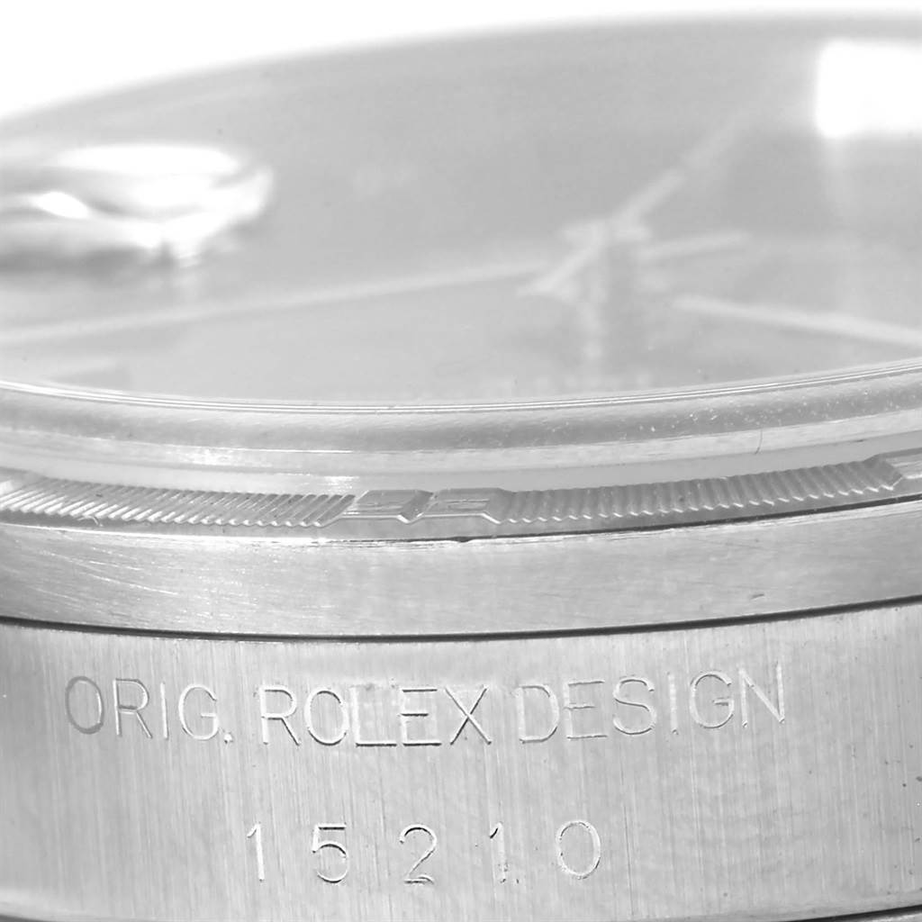 This close-up shows the side of a Rolex Date 15210 Men's Stainless Steel Black Dial 15210 Men's Stainless Steel Black Dial watch, highlighting the case and engraved model number "15210."