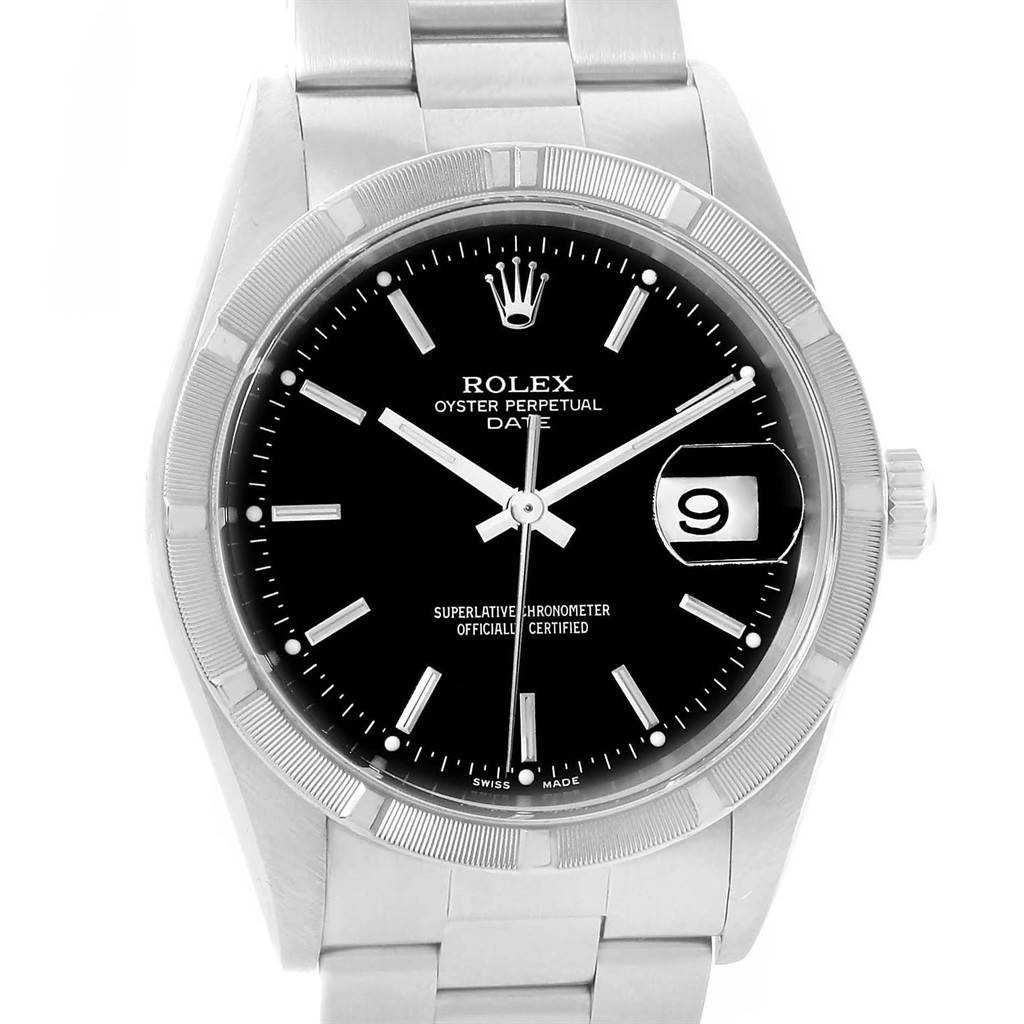 The image shows a frontal view of a Rolex Oyster Perpetual Date with a black dial, silver markers, and date window at 3 o'clock.