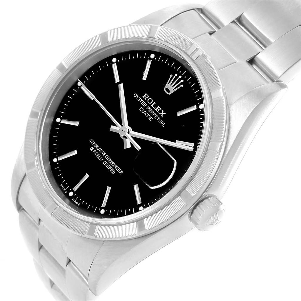The image shows a Rolex Oyster Perpetual Date watch from an angled view, highlighting the black dial, crown, and part of the bracelet.