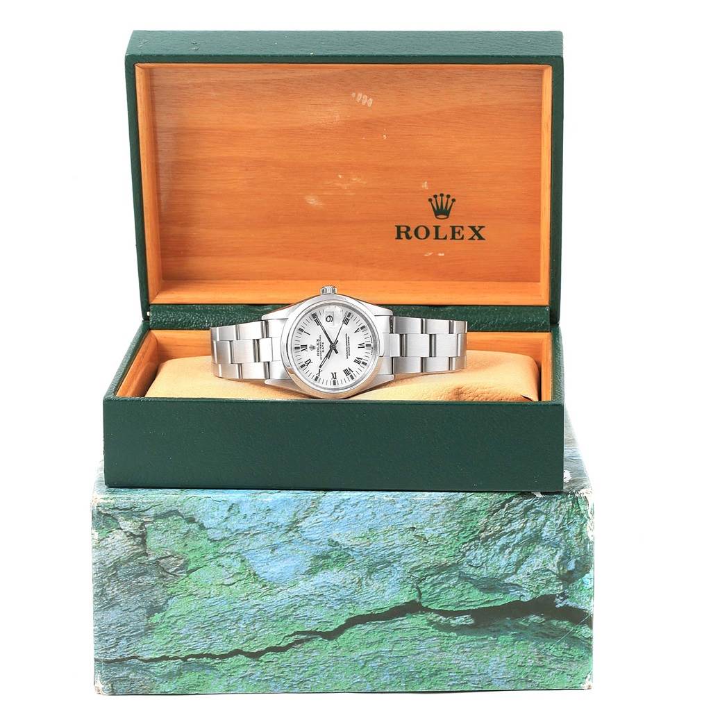 The Rolex Date 15200 Men's Stainless Steel White Dial 15200 Men's Stainless Steel White Dial model watch is shown front-facing inside an open green and wood-colored Rolex box.