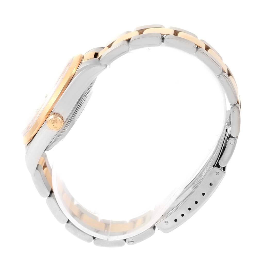 This image shows a side profile of a Rolex Date 15203 Men's Steel and Gold (two tone) White Dial 15203 Men's Steel and Gold (two tone) White Dial watch, highlighting its crown, case, and two-tone bracelet.