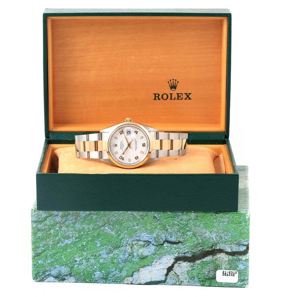 The image shows a front-view angle of a Rolex Date 15203 Men's Steel and Gold (two tone) White Dial 15203 Men's Steel and Gold (two tone) White Dial model watch in its open green and tan box.