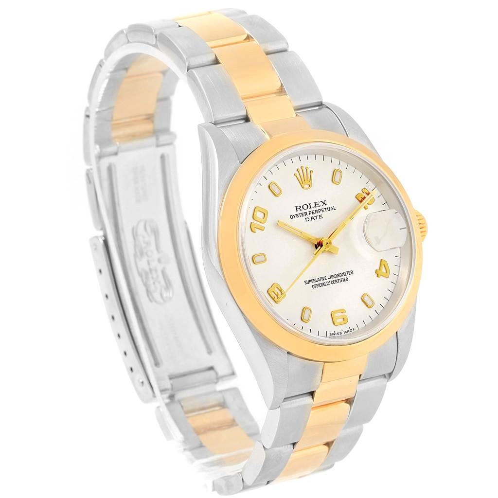 The image shows a Rolex Date 15203 Men's Steel and Gold (two tone) White Dial 15203 Men's Steel and Gold (two tone) White Dial model watch at an angle showcasing its face, bezel, and partially open bracelet.