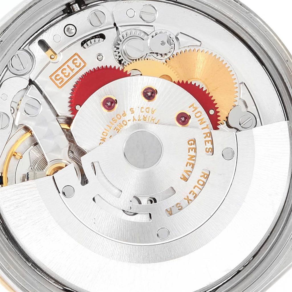 The image shows the internal mechanism of a Rolex Date 15203 Men's Steel and Gold (two tone) White Dial 15203 Men's Steel and Gold (two tone) White Dial model watch, highlighting gears and the rotor.
