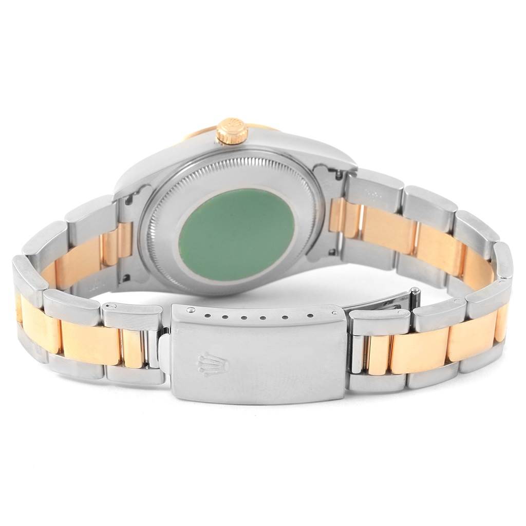 This image shows the backside of the Rolex Date 15203 Men's Steel and Gold (two tone) White Dial 15203 Men's Steel and Gold (two tone) White Dial model watch, highlighting the case back, bracelet, and clasp.