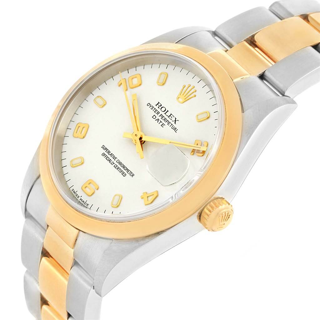 The image shows a Rolex Date 15203 Men's Steel and Gold (two tone) White Dial 15203 Men's Steel and Gold (two tone) White Dial model watch at a slight angle, highlighting its dial, bezel, and part of the bracelet.