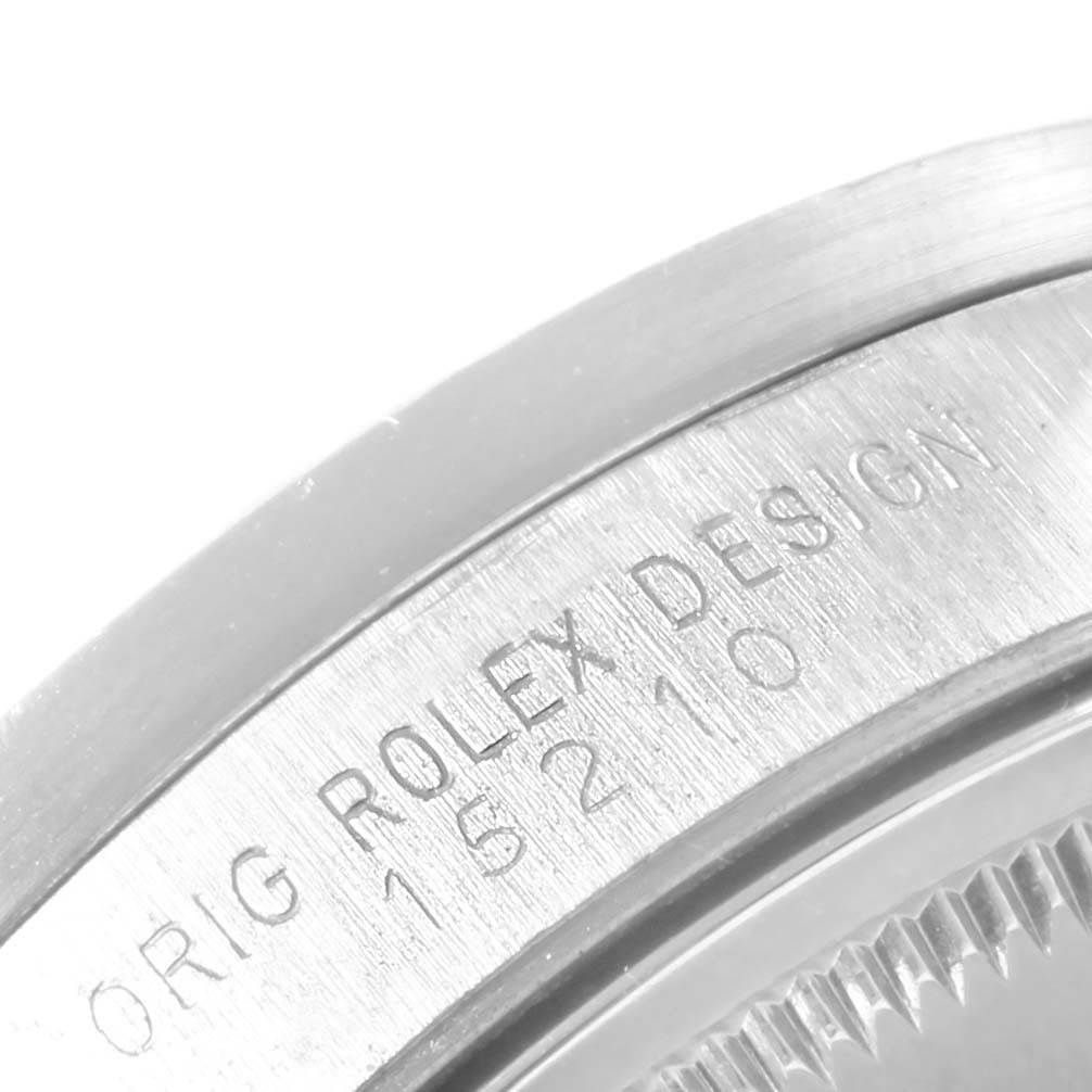 This image shows a close-up of the case's edge and engravings on a Rolex Date 15210 Men's Stainless Steel Black Dial 15210 Men's Stainless Steel Black Dial model watch.