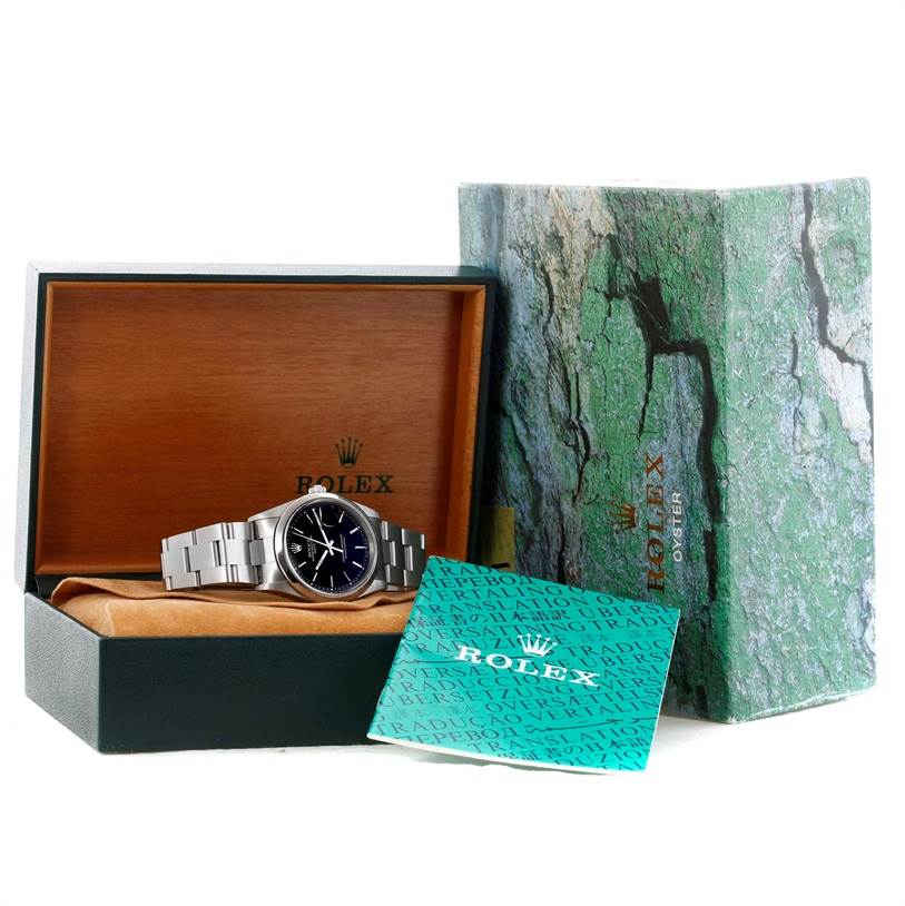 This image shows a Rolex Date 15200 Men's Stainless Steel Black Dial 15200 Men's Stainless Steel Black Dial model watch in its open wooden box, along with its outer green box and warranty card.